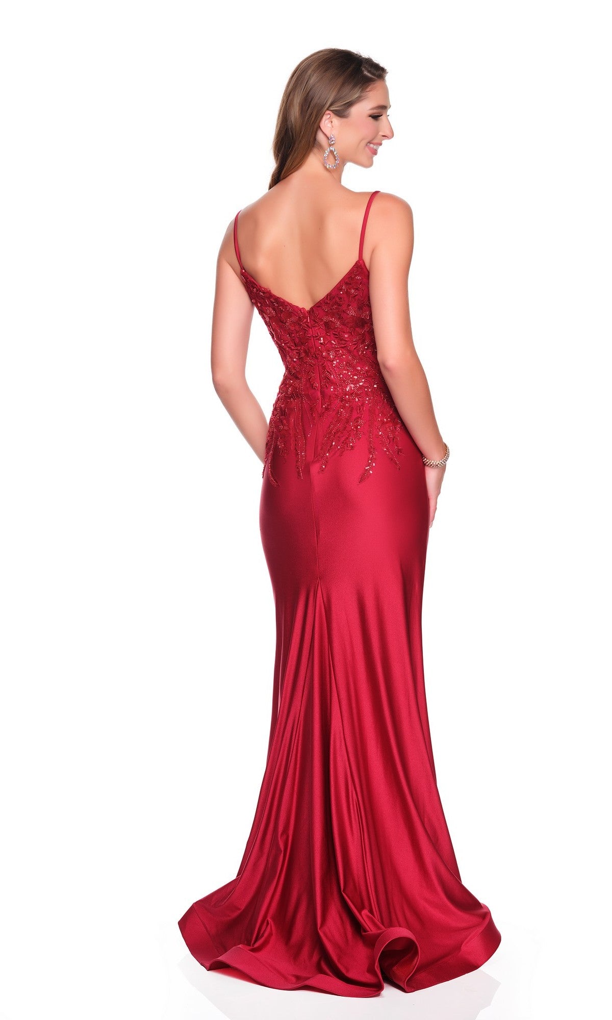 Woman wearing the Dave and Johnny 12881 long prom dress with a sequin-embellished bodice and thin straps, standing with her back to the camera against a white background.